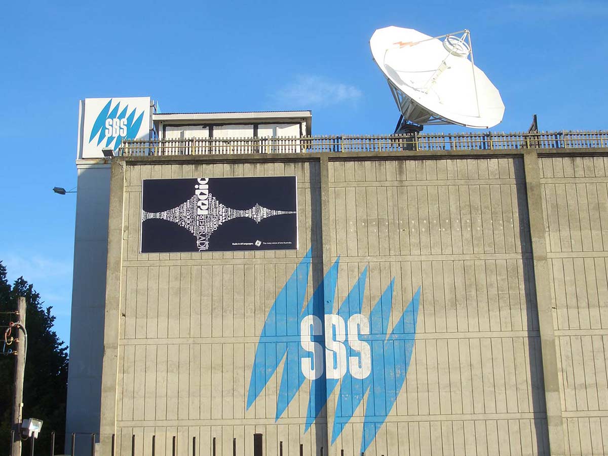 Photo shows side of concreting multi-storey building with the SBS logo, which is a blue stylized version of the Mercator projection map with the letters SBS in the middle