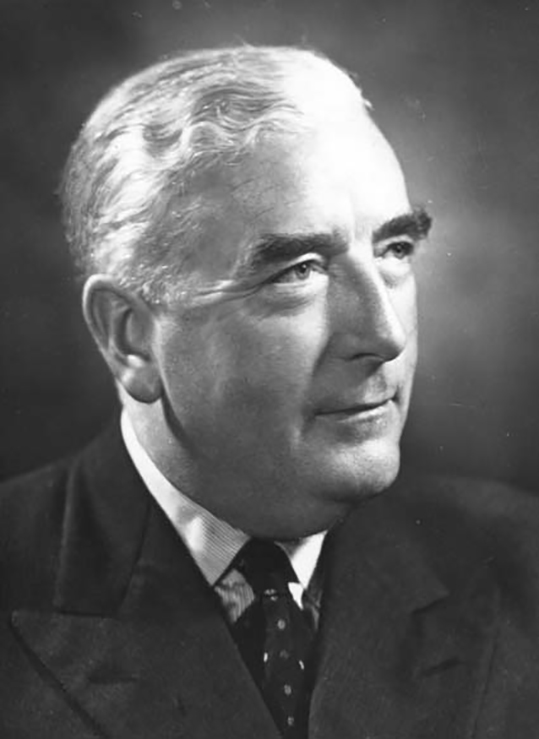 Sir Studio three-quarter profile portrait of Menzies, smiling. - click to view larger image