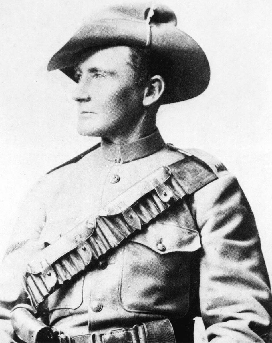 Black and white photo showing Morant from the waist up. He is in uniform with bandolier and slouch hat, face turned to his right. - click to view larger image