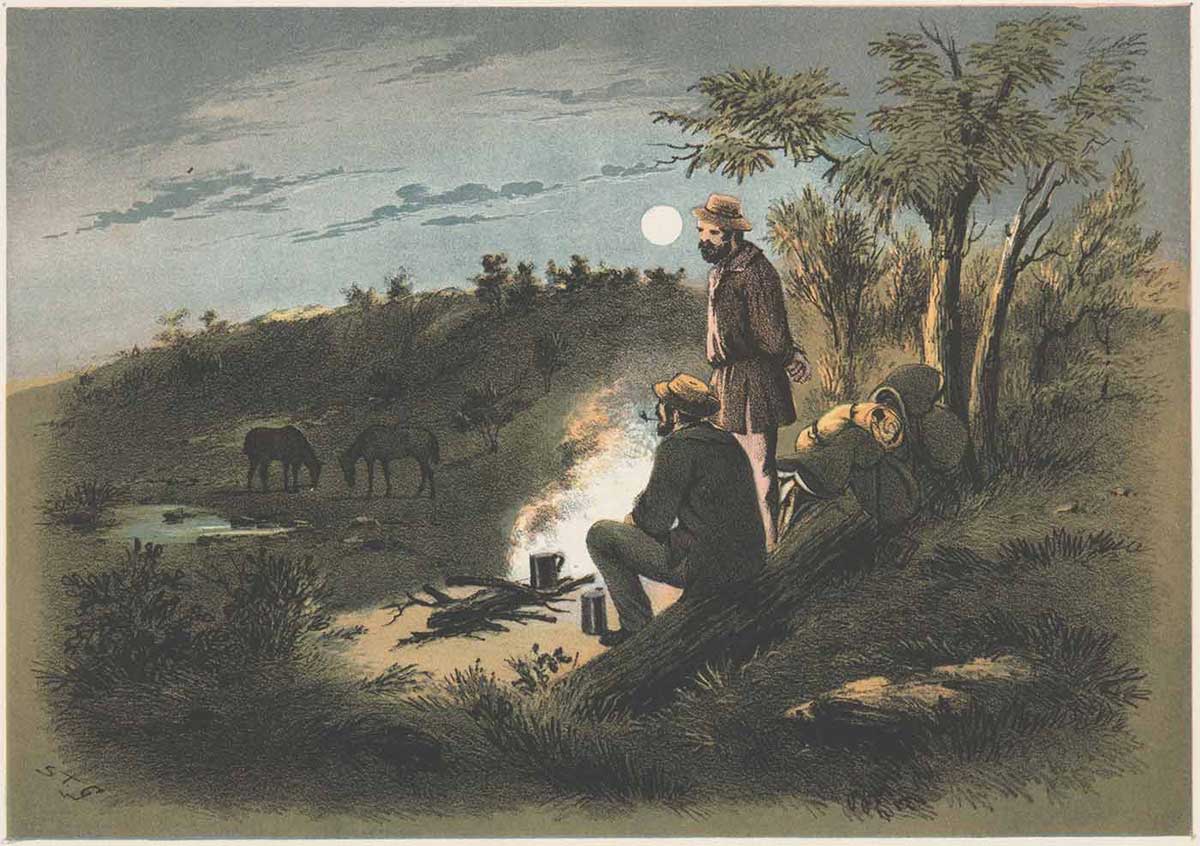 Watercolour painting of two men sitting and standing around a campfire at night with their swags beside them. In the distance are their two horses feeding on the grass. - click to view larger image