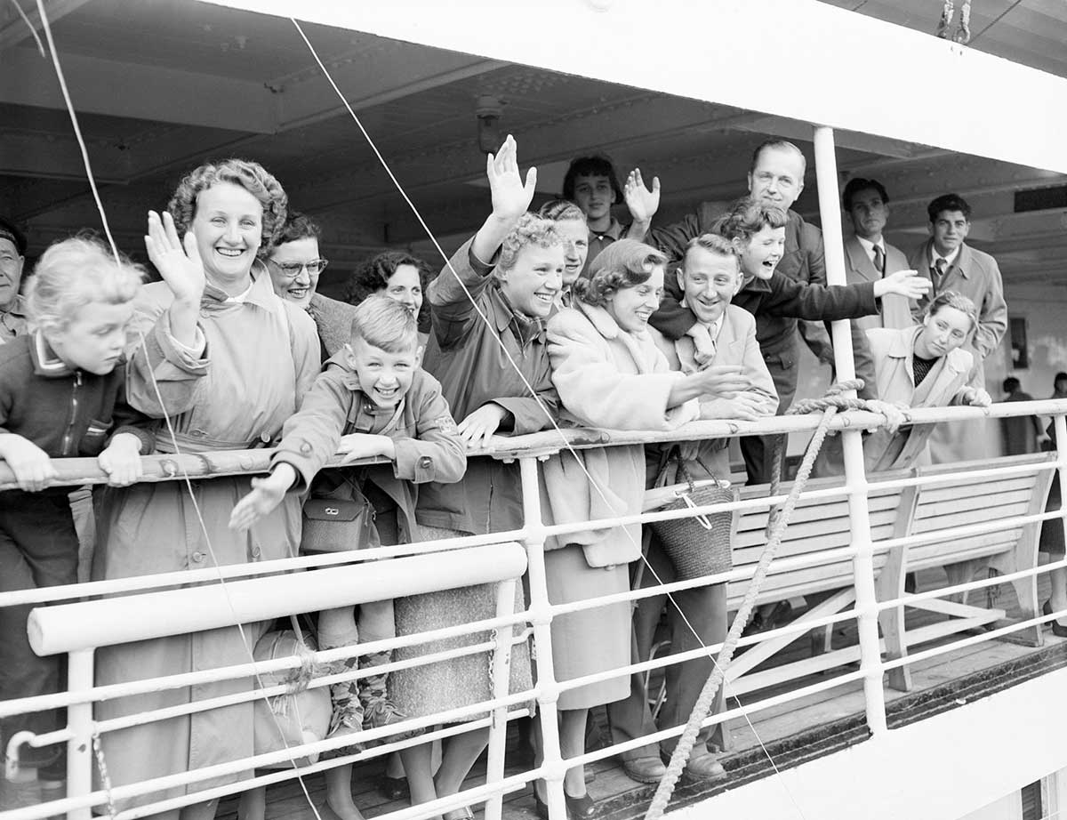 A group of new migrants aboard a ship arriving in Australia.