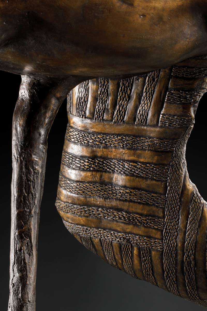 A detail image featuring designs on the inside of the bronze brolga sculpture's wing. - click to view larger image