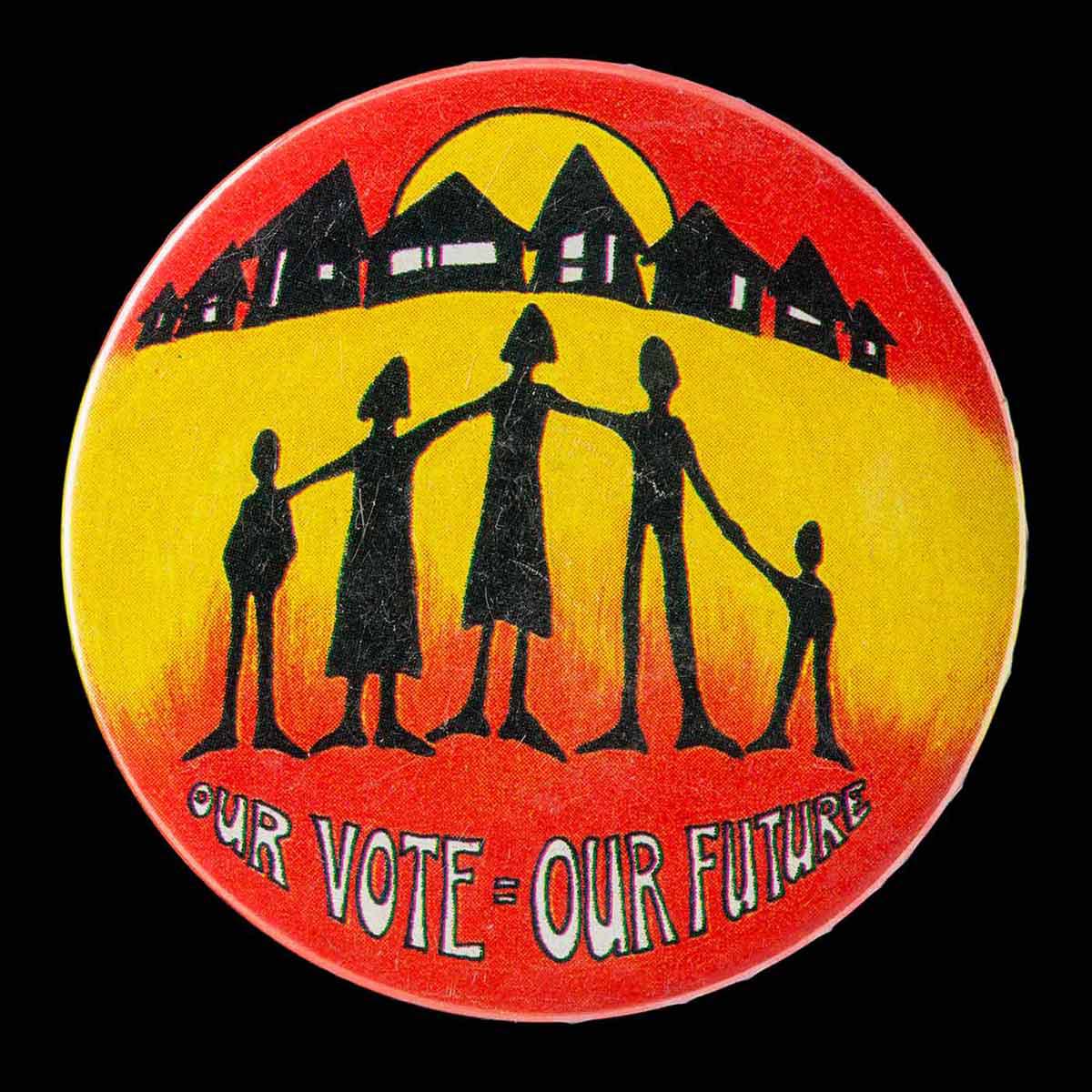 Circular badge with an illustration of silhouettes of human forms with a row of houses in the background and the text: OUR VOTE=OUR FUTURE. - click to view larger image