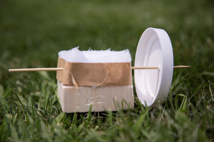 A photograph illustrating Step 4 in the construction of the toy horsedrawn cart.