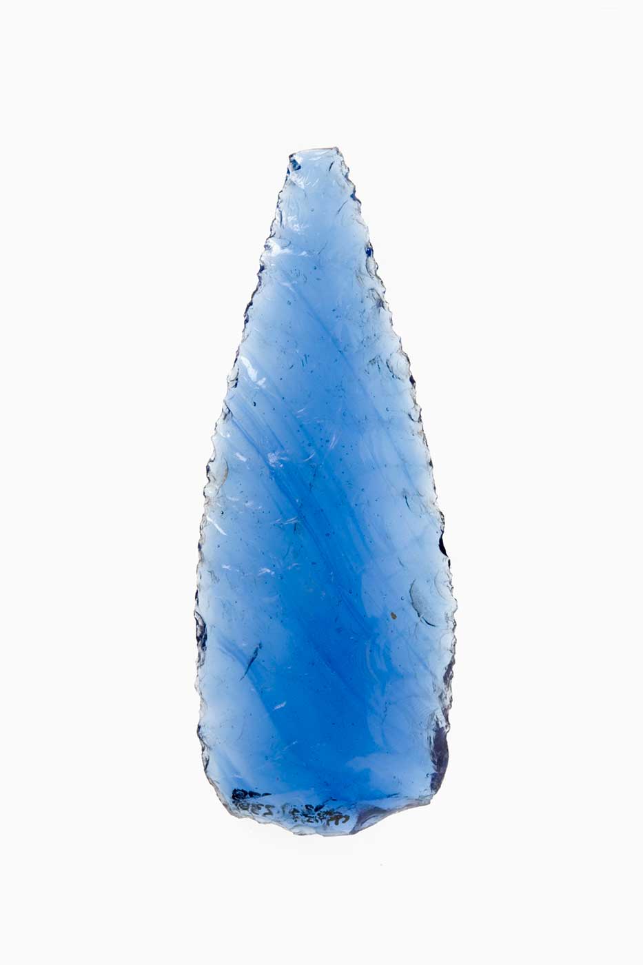 A piece of blue glass, honed to a point. - click to view larger image