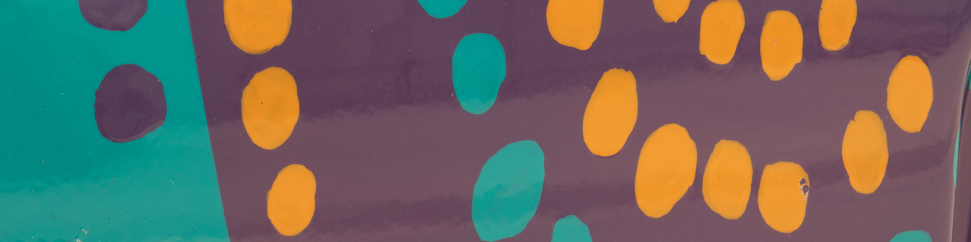 Cropped image of Wunala Dreaming design by John Moriarty, from a Twingo car, featuring teal, orange and purple dots.