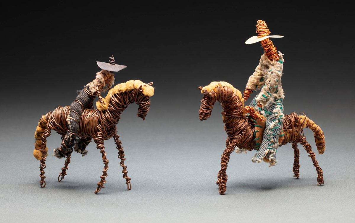 Toys of riders on horses made from found objects.