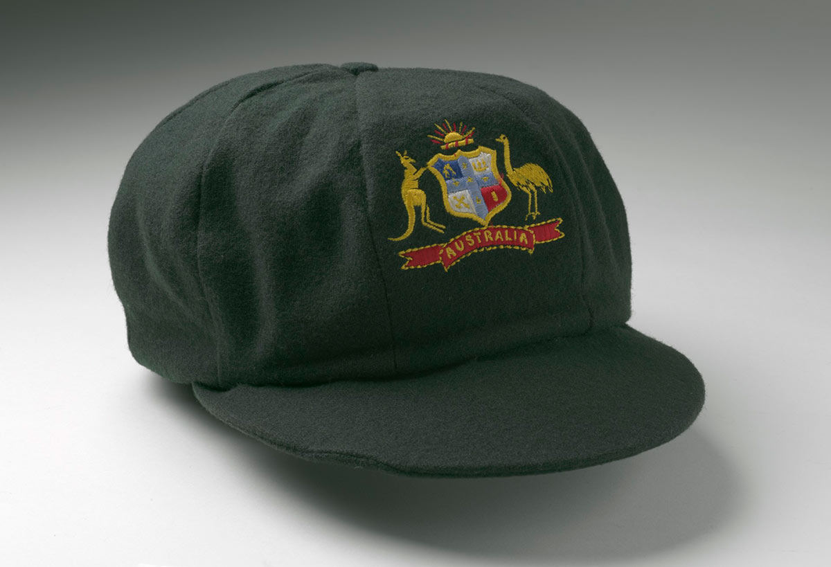 'Baggy green' cricket cap with embroidered badge featuring an unofficial Australian coat of arms.