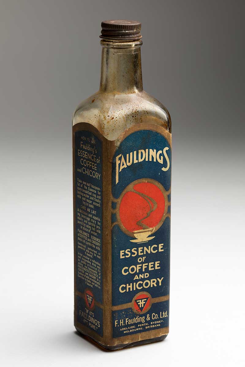 Colour photograph of an old bottle with a label that reads 'Faulding's Essence of Coffee and Chicory'. - click to view larger image