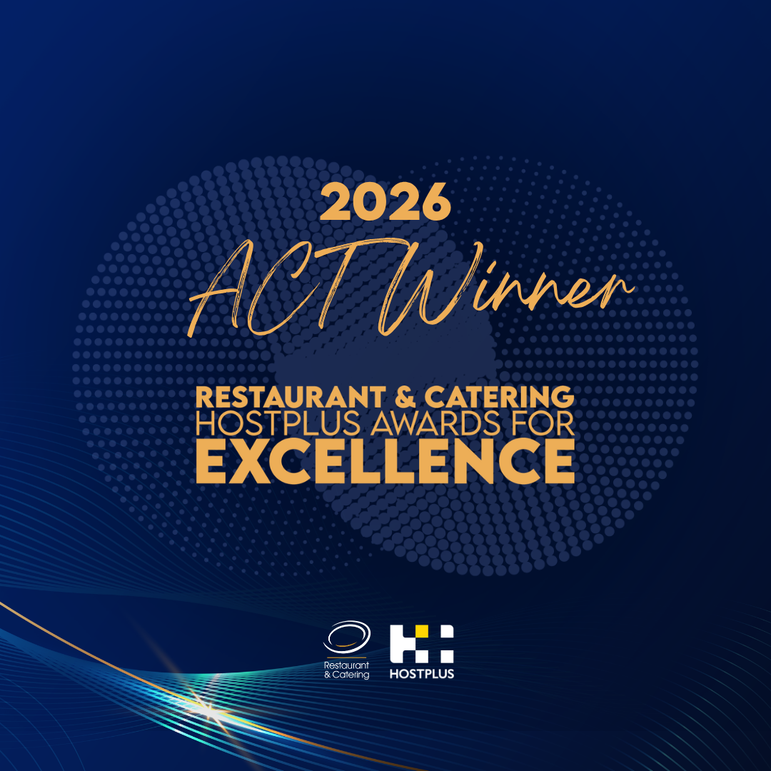 Blue square tile with yellow writing for catering award