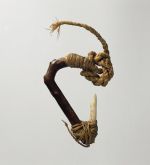 Fishhook with wooden shank, bone point, and lashing of twisted cords of plant material.