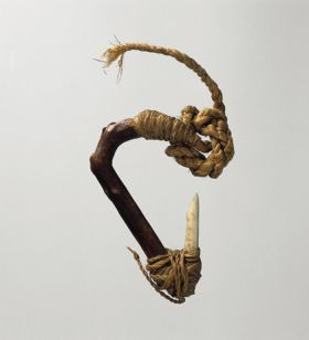 Fishhook with wooden shank, bone point, and lashing of twisted cords of plant material.