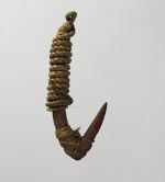 Two-part fishhook made of wood, with twisted cord, and lashing made of plant material.