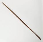 Digging stick made of a dark brown heavy wood.