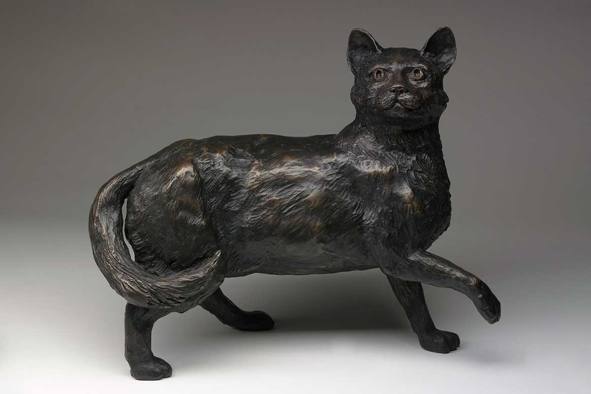 Bronze statue of a cat.