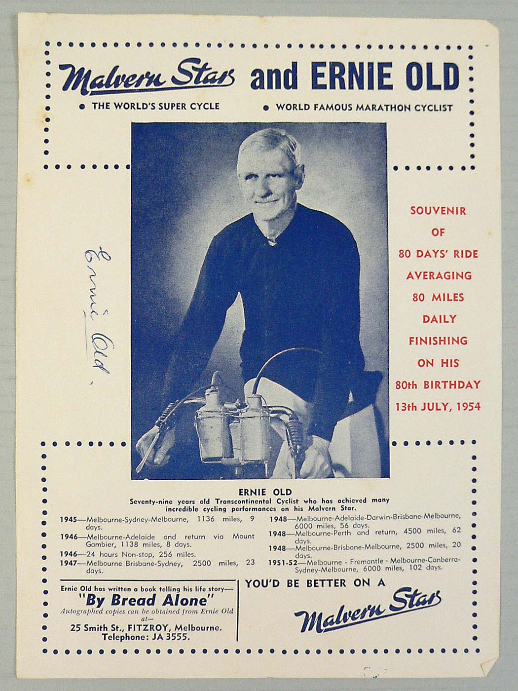 Blue and white poster with a central image of a man on a bike. - click to view larger image