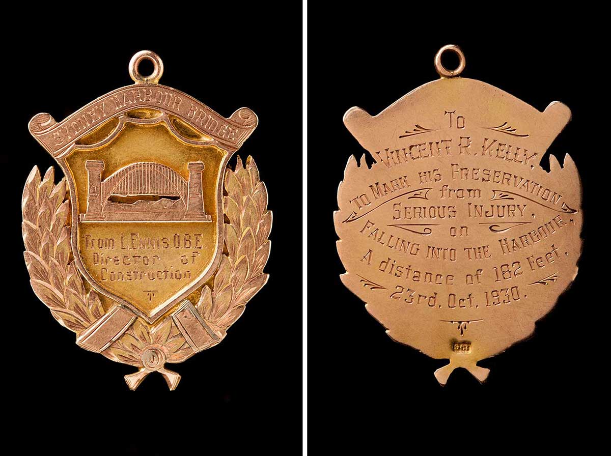 The front and back of a medal awarded to Vince Kelly.  The front has an image of the Sydney Harbour Bridge with an inscription that reads: 'From L. Ennis. O.B.E. Director of Construction'. The inscription on the back reads: 'To Vincent R. Kelly. To mark his preservation from serious injury on falling into the harbour. A distance of 182 feet. 23rd. Oct. 1930.' - click to view larger image