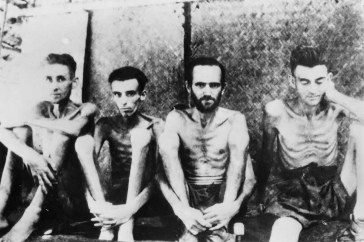 Four prisoners of war with beriberi, Tarsau, now known as Nam Tok. 130 kilometres from Nong Pladuk (also known as Non Pladuk), or 284 kilometres south of Thanbyuzayat. It was used by the Japanese as both a staging camp for POWs moving north to work on railway construction, and a base hospital during the period from November 1942 to April 1944 - click to view larger image