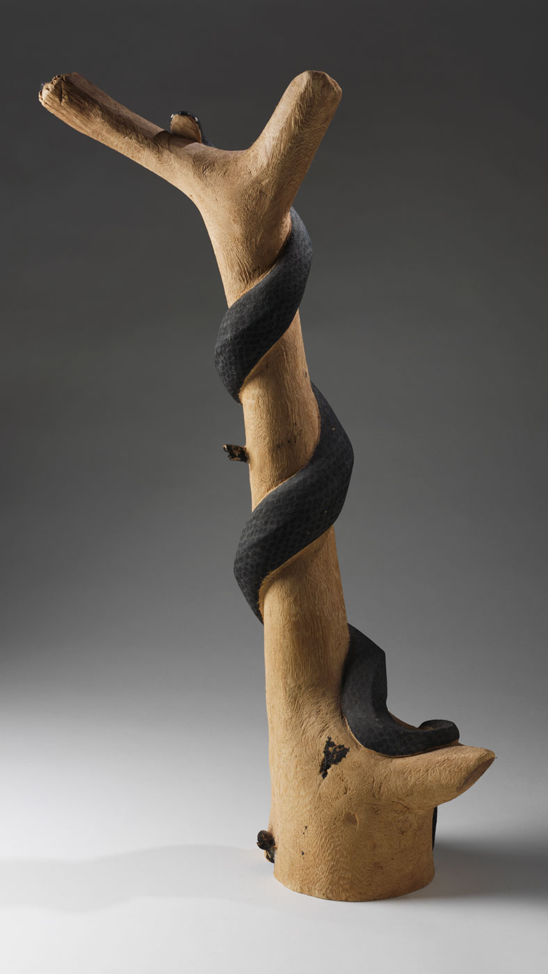 Carved snake 1973 made by Clifford Possum Tjapaltjarri. - click to view larger image