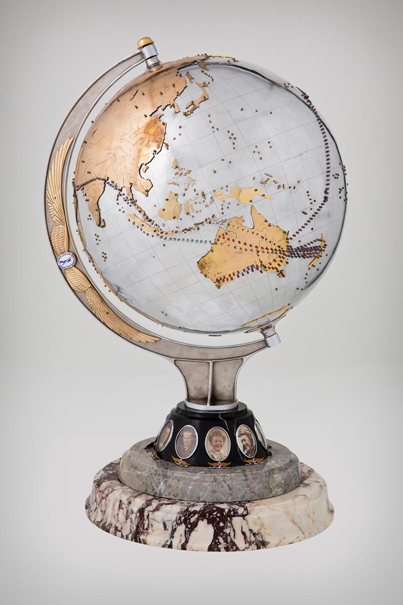 Metal globe studded with coloured stones marking the flight paths of Charles Kingsford Smith's plane the 'Southern Cross' - click to view larger image