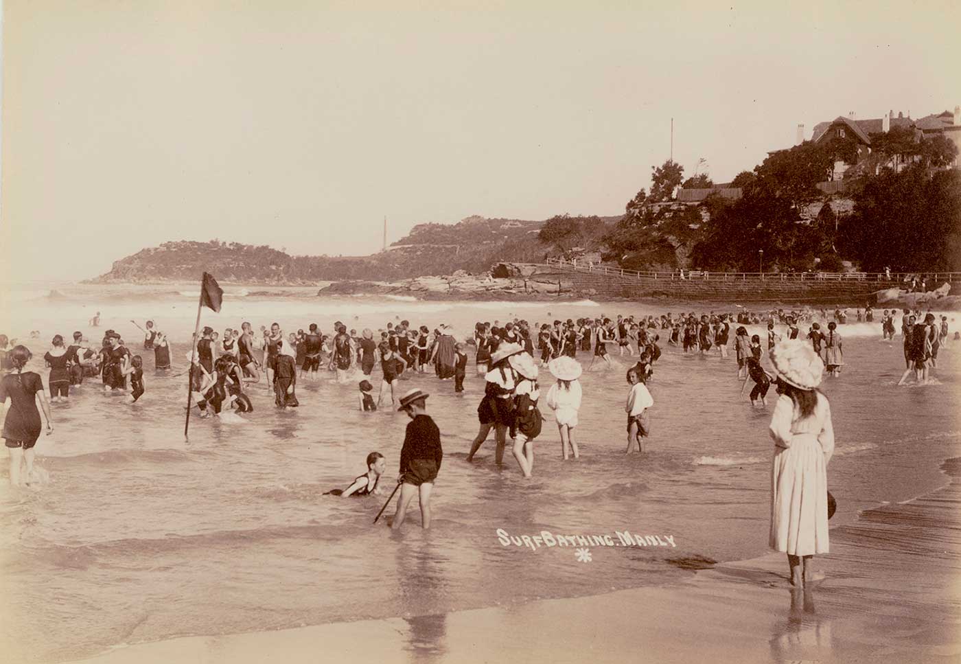 People bathing in the surf at Manly Beach, New South Wales, in the early 1900s.