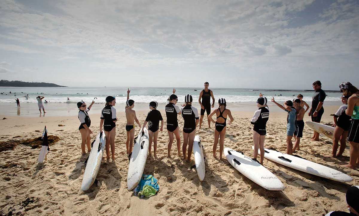 Junior lifesavers on the beach with their surfboards at Mollymook, New South Wales, 2006.