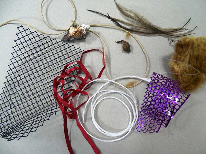 A range of materials required to make some wearable art including: Do you have string, plastic strapping, mesh, raffia, wool and elastic.
