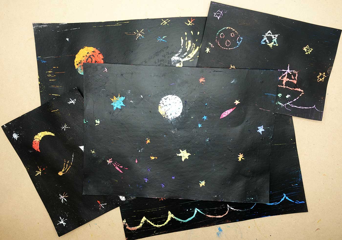 A series of paintings featuring stars and planets in the sky.