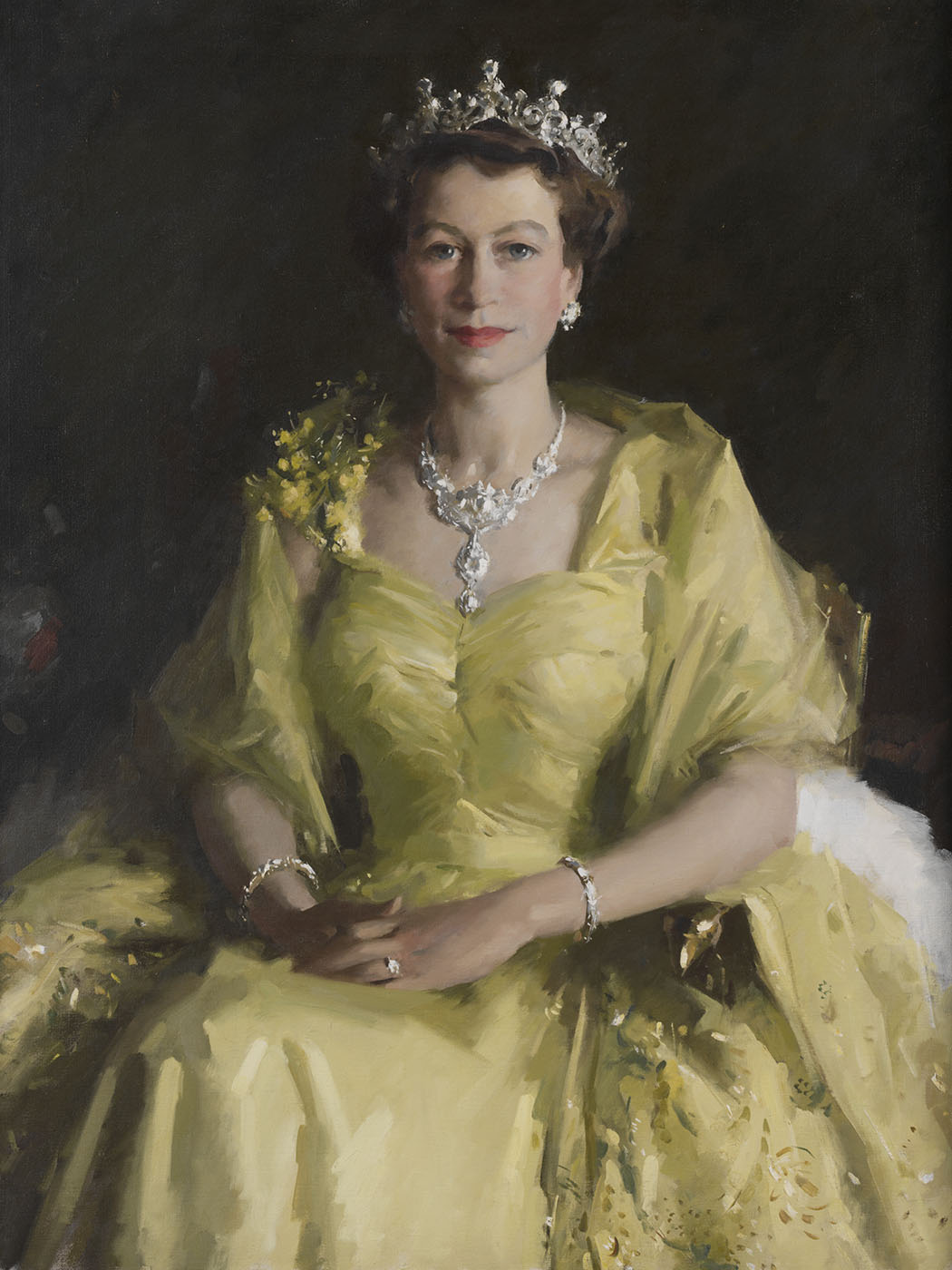 Detail of portait of Queen Elizabeth II wearing a pale yellow dress and tiara.