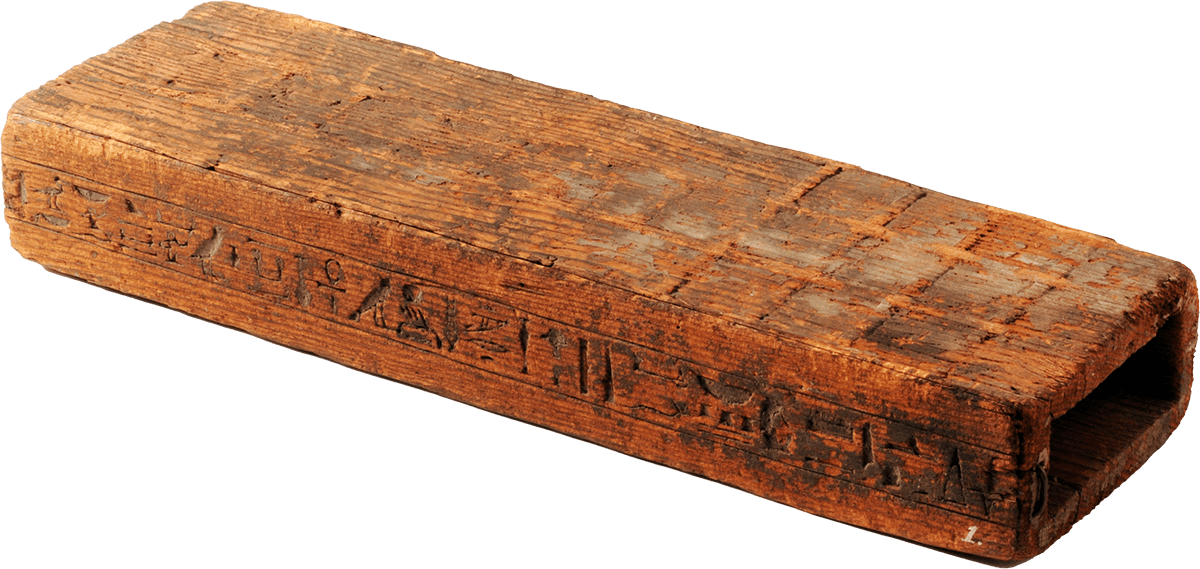 A long rectangular wooden game board, with engravings on the top and side.