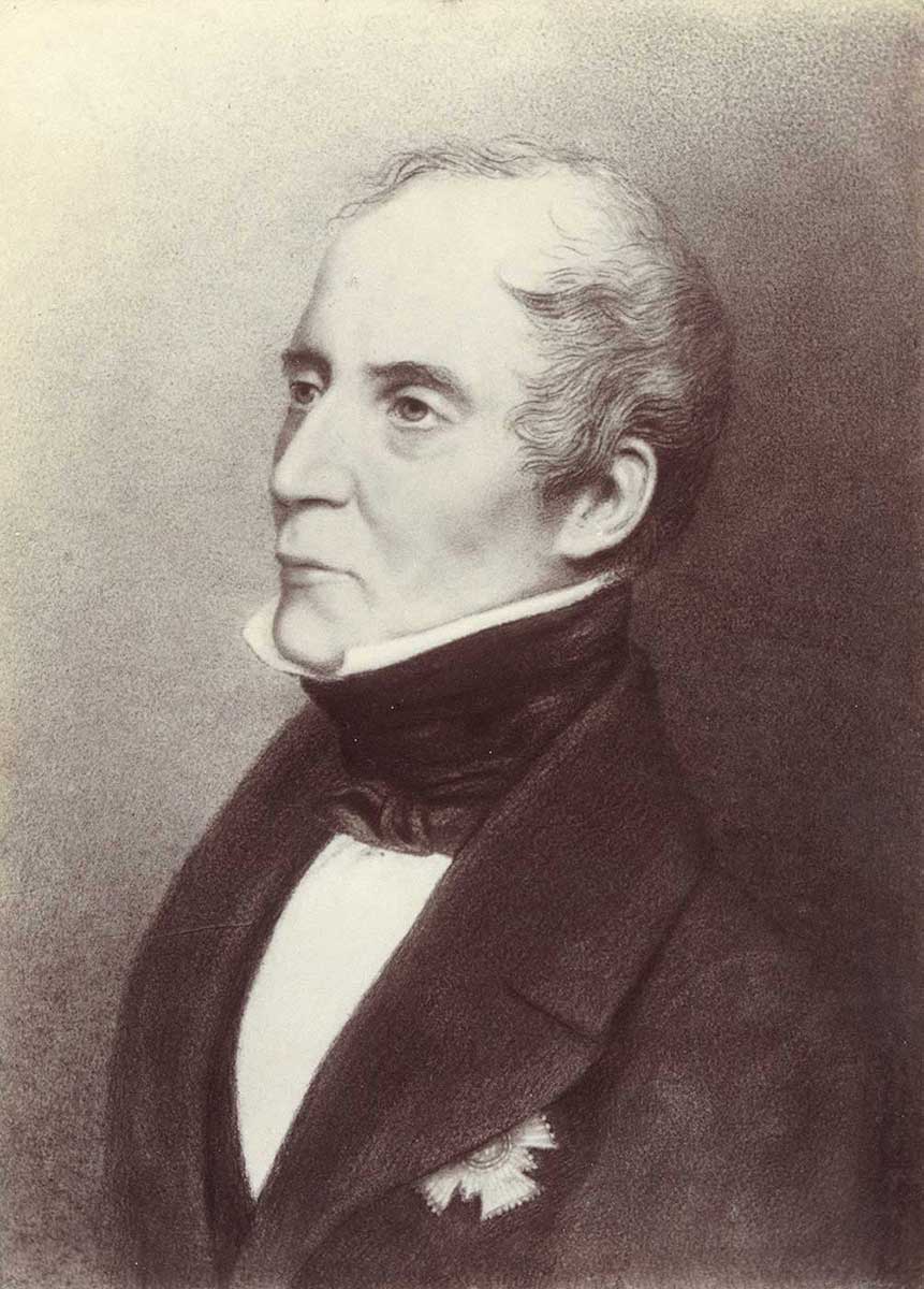 three-quarters portrait of a middle-aged man dressed in frock coat and cravat. A decoration of some kind on his left breast is concealed by the large lapels - click to view larger image