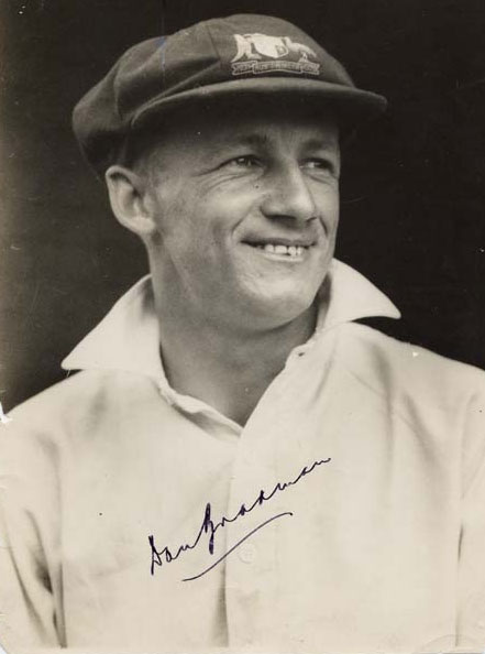 Portrait photo of Donald Bradman smiling, photo signed by him - click to view larger image