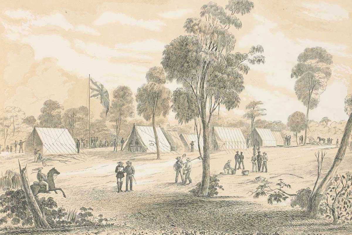 Black and white illustration showing a landscape view of a seven tents erected near a large British flag, flying among gum trees. Several men are gathered in small groups and another rides a horse. - click to view larger image