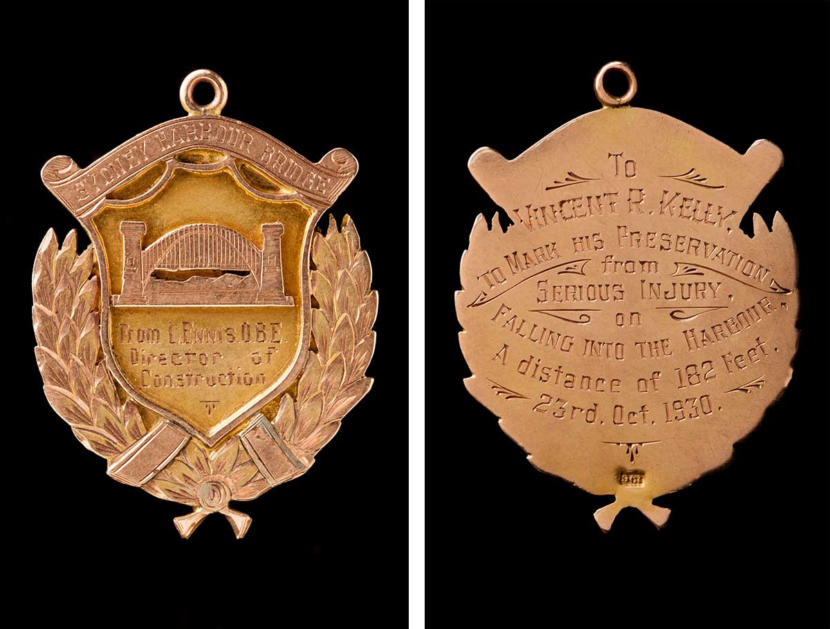 The front and back of a medal awarded to Vincent Kelly.  The front has an image of the Sydney Harbour Bridge with an inscription that reads: 'From L. Ennis. O.B.E. Director of Construction'. The inscription on the back reads: 'To Vincent R. Kelly. To mark his preservation from serious injury on falling into the harbour. A distance of 182 feet. 23rd. Oct. 1930.'