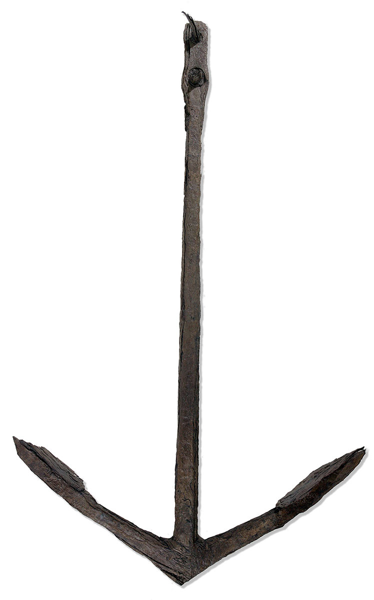 A large anchor, dark brown in colour, and rusted in appearance. - click to view larger image
