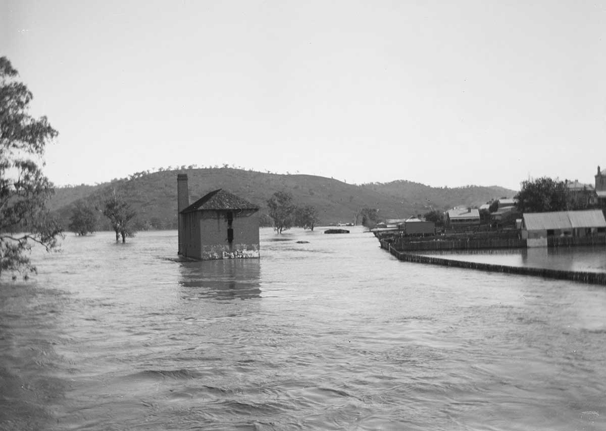 A flour mill surrounded by water