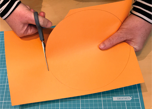 hands cutting paper