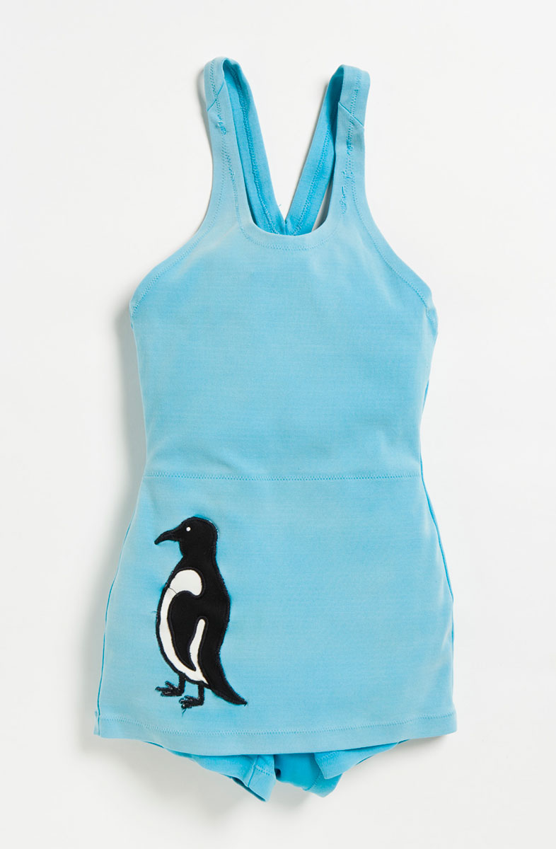 Light-blue one-piece swimsuit with an image of a penguin on the bottom left hand side. - click to view larger image
