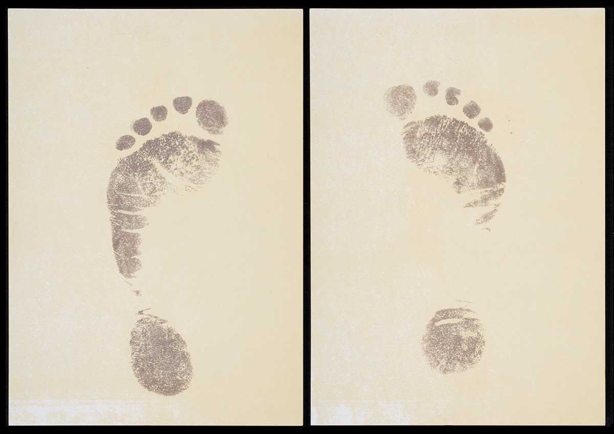 Two pages of off-white card, with printed footprints. - click to view larger image