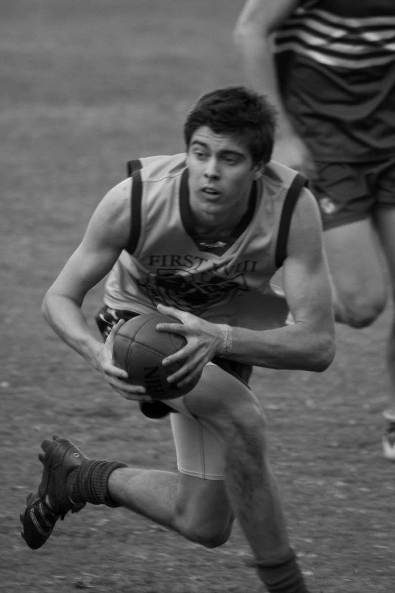 Black and white photograph of Jack Klemich playing football. - click to view larger image