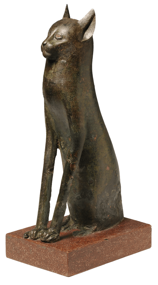 A statue of a cast bronze cat on a small wooden plinth.
