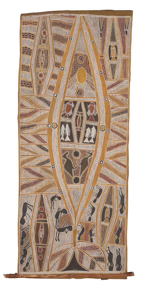 A bark painting worked with ochres on bark and with a wooden restrainer at one end. The painting depicts a central, yellow elliptical form containing a design incorporating a crab, six fish and two bird. There is a smaller elliptical form in each corner containing similar designs. The painting has a crosshatched background. - click to view larger image