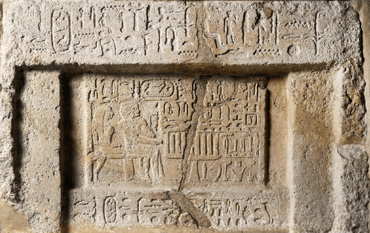 A stone block carved with hieroglyphs.