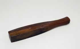 Barkcloth beater made from a piece of the heavy hardwood with its four sides feature a number of coarser to finer grooves.