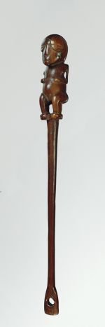 Flywhisk handle made of ironwood, with the lower part shaped like a human figure and the upper part consisting of a spoon-like form.