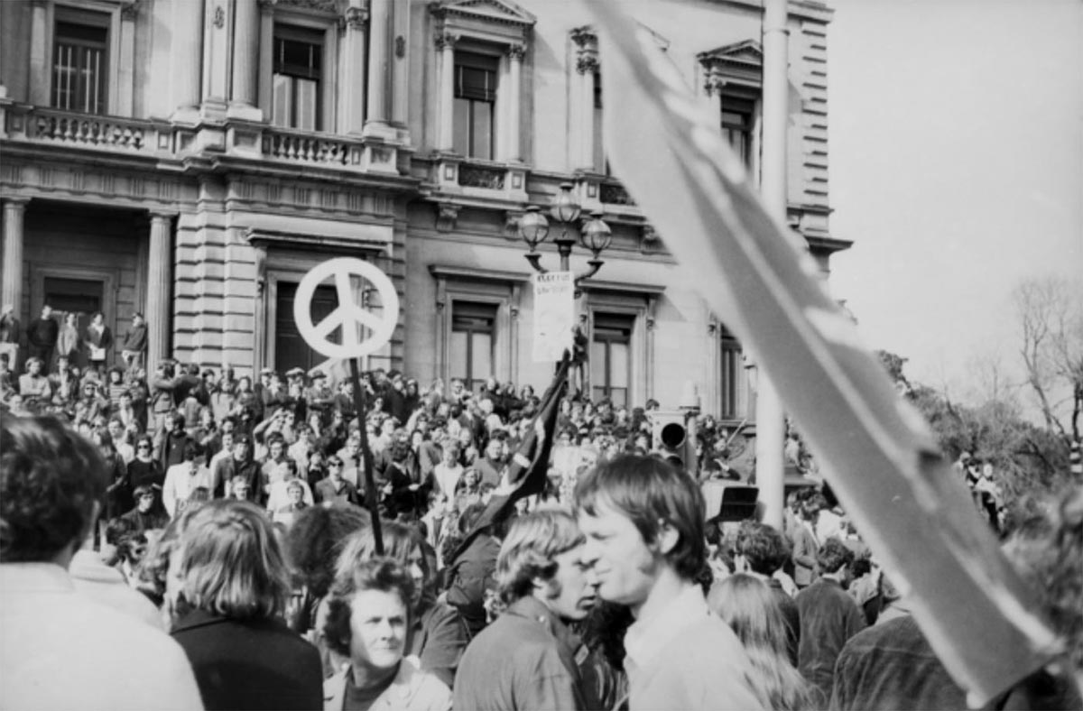 A black and white photo taken in the 1970s of a crowd of protestors. - click to view larger image