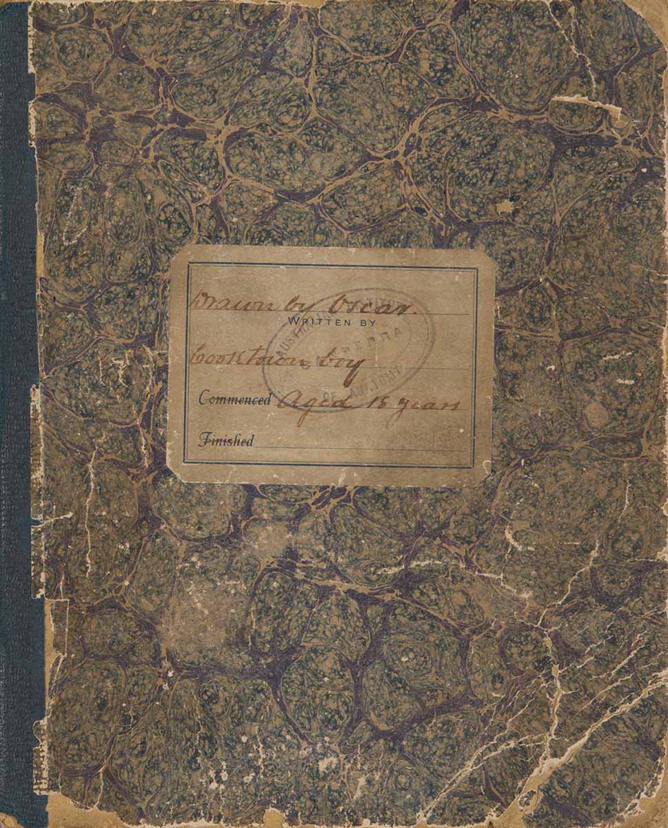 An exercise book with marbled paper on the front and the back covers, and a green fabric spine. A label attached to the front cover reads, Drawn by Oscar. Cooktown boy. Aged 18 years. - click to view larger image
