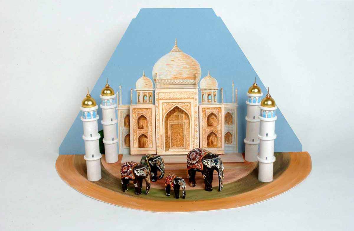 A painted carboard and polystyrene diorama of the Taj Mahal, which includes four model elephants. - click to view larger image