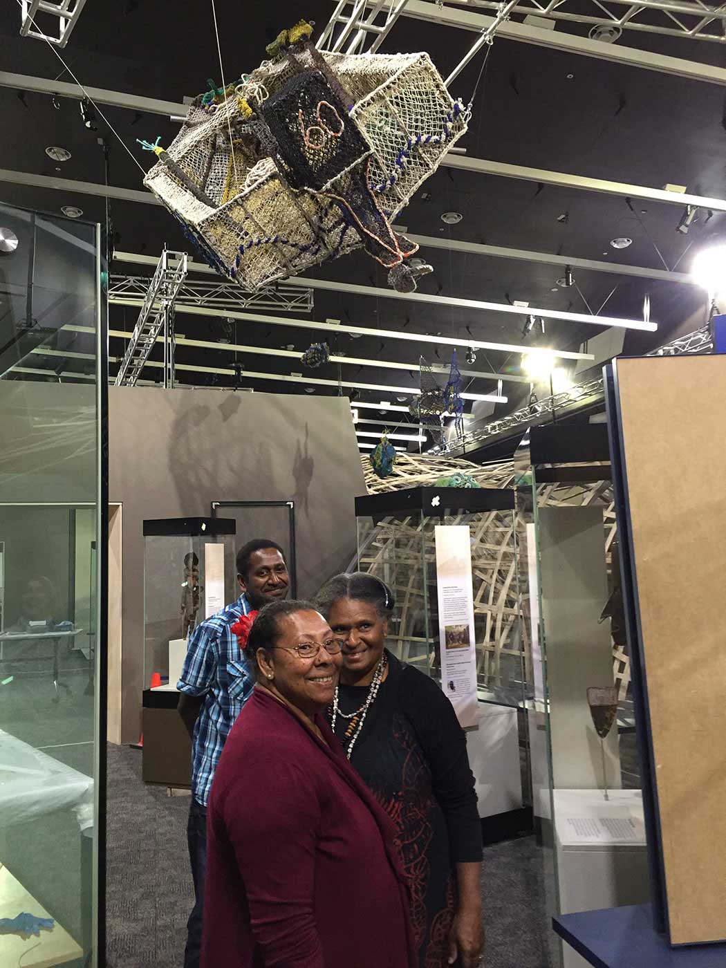 A colour photo of people inside an exhibition. - click to view larger image