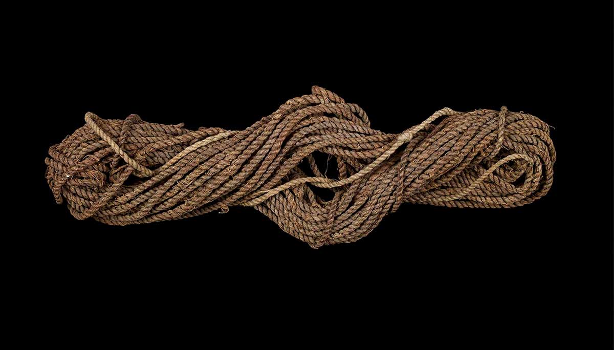 Fishing-line made of twisted brown bark fibre. - click to view larger image